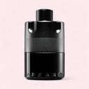 Black Azzaro perfume bottle on a light pink background