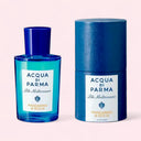 Marine blue Acqua Di Parma Blu Mediterraneo Eau de Toilette 100ml bottle (left side) and marine blue cylinder packing (right side) on light neutral pink background