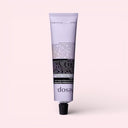 Purple tube of Aesop Eleos Aromatique Hand Balm 75ml on a light pink background