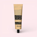 Aesop Rejuvenate Intensive Body Balm 100ml tube with 'Aesop' branding on a light pink background