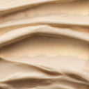 Close-up of beige cream texture of Aesop Reverence Aromatique Hand Balm 75ml