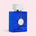 Blue Armaf Club De Nuit Iconic For Men Eau de Parfum 105ML perfume bottle with silver cap and crystal accessories on a light pink background | BEAUTE KNOWS AUSTRALIA