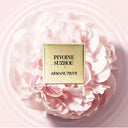 Armani Privé Les Eaux Hand Soaps Discovery Trio Set's Pivoine Suzhou scent on gold plate. The scent's commercial fragrance mood image on a pink floral background | BEAUTE KNOWS AUSTRALIA