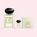 Content of Armani Prive The Yulong Eau de Toilette 100ml Set including Armani Prive Thé Yulong perfume bottles and scented soap on a light pink background