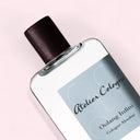 Close up of Atelier Cologne Oolang Infini Cologne Absolue Pure Perfume 100ML perfume bottle labeled 'Atelier Cologne Oolang Infini' on a light pink background | BEAUTE KNOWS AUSTRALIA