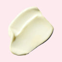 Creamy white substance on a pink background