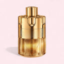 Gold Azzaro perfume bottle on a light pink background