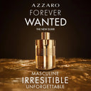Gold Azzaro Forever Wanted Elixir Eau de Parfum 100ml perfume bottle on a dark background with text about the fragrance.