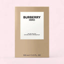 Burberry Hero perfume packaging on a light pink background