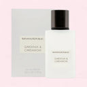 Banana Republic Gardenia & Cardamom perfume bottle and packaging on a light pink background