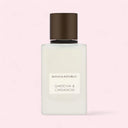 Banana Republic Gardenia & Cardamom perfume bottle on a light pink background
