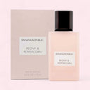 Banana Republic Peony & Peppercorn perfume bottle and packaging on a light pink background