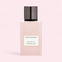 Banana Republic Peony & Peppercorn perfume bottle on a light pink background
