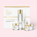 Beauty of Majesty BOM Peptide Power 5 Piece Gift Set with skincare products including sleeping mask, power toner, power eye cream, power ampoule and face cream on a pink background 