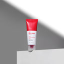 BEAUTE KNOWS Red and whiteBeauty of Majesty BOM AC Red Free Cream 50ml tube on a gray background