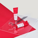 BEAUTE KNOWS Red Beauty of Majesty BOM AC Red Free Serum 30ml tube with dropper dispenser on a red and white background