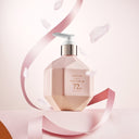 Beauty of Majesty BOM LIGHT ON In Shower Body Tone Up Lotion 290ml Pink bottle with pump on a soft pink background