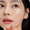 Close-up of a woman's face with a focus on her skin.