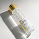 Beauty of Majesty BOM Peptide Power Toner 150ml bottle labeled 'Peptide Power Toner' with a gold cap on a reflective surface.