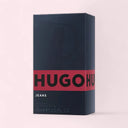Hugo Boss Jeans perfume packaging on a light pink background