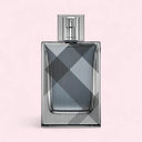Perfume bottle with checkered pattern on a light pink background