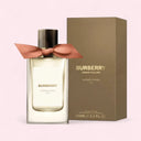 Burberry Garden Roses perfume bottle with packaging on a light pink background