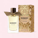 Burberry Snow Blossom perfume bottle and packaging on a light pink background