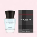 Burberry Touch for Men perfume bottle and packaging on a light pink background
