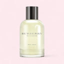Bottle of Burberry Weekend for Men cologne on a light pink background