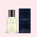 Burberry Weekend for men eau de toilette bottle and packaging on a light pink background