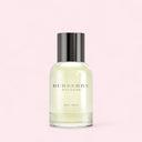 Bottle of Burberry Weekend for Men cologne on a light pink background