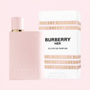 BEAUTE KNOWS Pink Burberry Her Elixir Eau De Parfum 100ml bottle and packaging on a light pink background