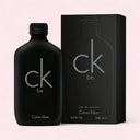 Black Calvin Klein Be perfume bottle and packaging on a light pink background