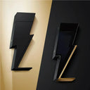 Carolina Herrera Bad Boy Eau de Parfum 50ml Black lightning bolt-shaped perfume bottles on a black and gold background