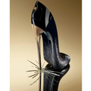 Carolina Herrera Good Girl Supreme Eau de Parfum 30ml Black highheel shoe  shaped perfume bottle with gold accents on a reflective surface against a gold background