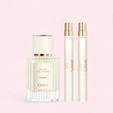 close up pf Chloe Atelier Des Fleurs perfume set content: 1 x Cedrus Eau De Parfum 50ml bottle, 1 x Magnolia Alba Eau de Parfum pen spray 10ml and 1 x Ylang Cananga Eau de Parfum pen spray 10 ml  on a pink background