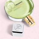 Chanel Chance Eau Fraiche Eau de Toilette 35ml perfume bottle and cap on a pink background