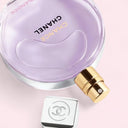 Chanel Chance Eau Splendide Eau de Parfum perfume bottle with cap and silver square on a pink background