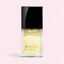 Chanel Cristalle Eau de Parfum 100ml perfume bottle on a light pink background