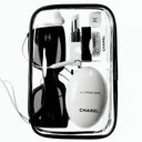 Chanel La Crème Main hand cream 50ml bottle in a clear bag along with other accessories like sunglass, ipods. facial cream, lip balm and lipstick