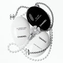 Chanel le creme main hand cream set with black and white containers on a white background
