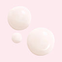 Three light neutral pink coloured drops of different sizes on a pink background