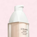 Chanel Le Blanc serum healthy light creator bottle on a pink background