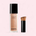 Chanel Les Beige Water Tint - Light Shade with applicator on a light pink background