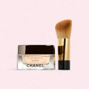 Chanel Sublimage Le Teint Cream Foundation 30g - 01 Beige product with a brush on a light pink background