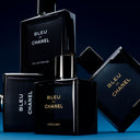 BEAUTE KNOWS Bleu de Chanel L'Exclusif 100ml perfume bottles and packaging on a dark blue background