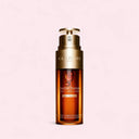 Clarins Double Serum Light Texture 50ml bottle on a pink background