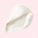 White Clé de Peau Beauté Clarifying Cleansing Foam smear on a pink background