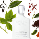 BEAUTE KNOWS White Creed Silver Mountain Water Eau de Parfum 50ml perfume bottle surrounded by leaves and spices on a white background