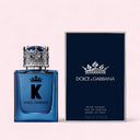 Dolce & Gabbana K Eau de Parfum 50ml perfume bottle and packaging on a light pink background